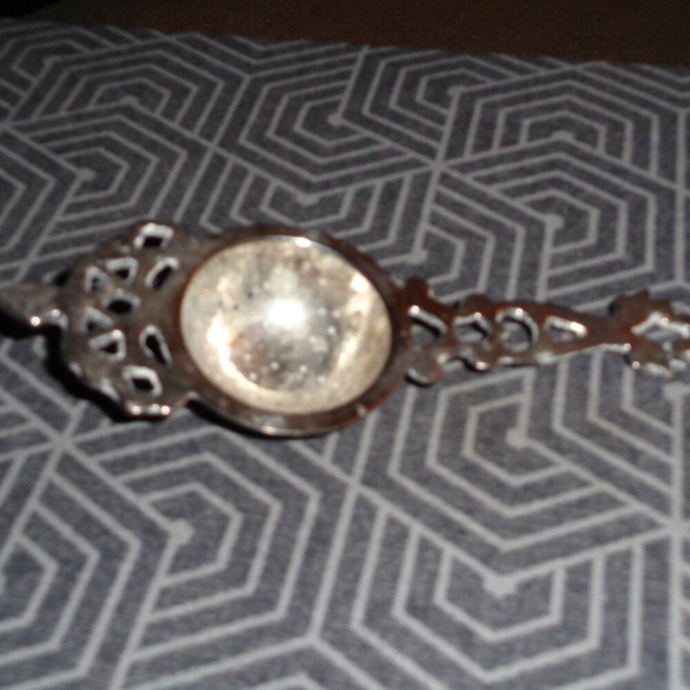 Antique Repoussé Tea strainer